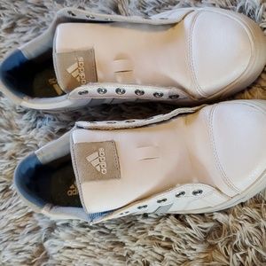Adidas golf shoes.‎